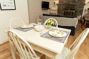 Dining table with dishes and utensils.