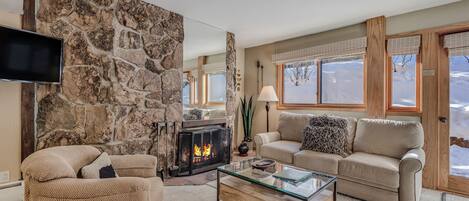 Living room with wood-burning fireplace