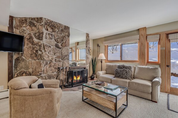 Living room with wood-burning fireplace