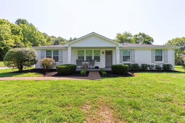 Perfect front porch for sipping coffee in the rocking chairs
