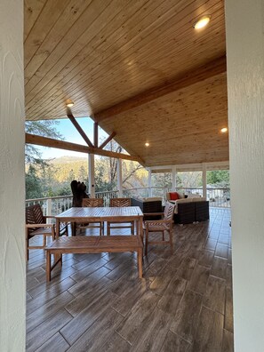 Patio Deck with seating and outdoor dining table, views to nature.