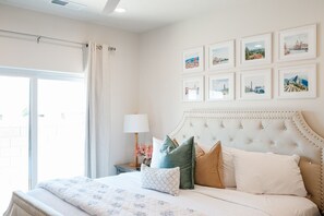 Quiet downstairs master bedroom with patio access — perfect for morning coffee or quiet breaks