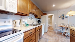 Kitchen with toaster, drip coffee maker, blender, and more