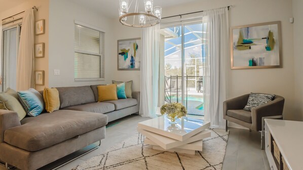 Living room overlooking patio pool area
