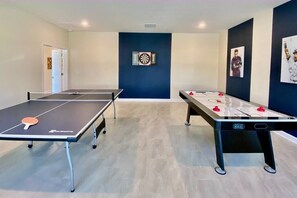 Spacious Game room - Ping pong table, Air hockey table and Dartboard game