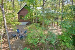 Large private setting with fire pit in the woods.