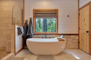 Luxury bathtub in the oversized bathroom.