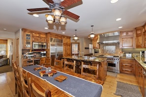 Dining and gourmet kitchen with counter top bar seating for 14.