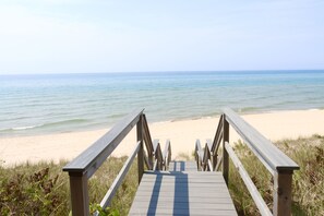 Our sand dune bluff is about 35 yards and  30 stretching steps to the beach.