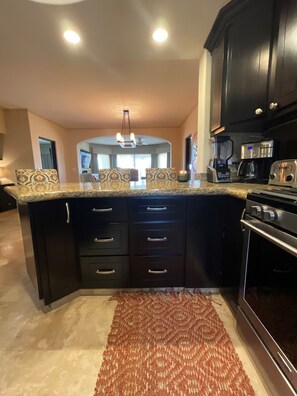 Kitchen Island seats three people. 