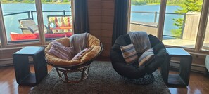 Two comfy papasan chairs, a perfect venue for a cup of morning coffee or a book.