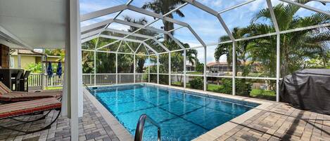 Beautiful lanai and pool overlooking canal