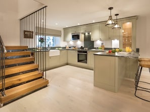 The open plan kitchen and staircase at Shepherd's View, Lake District