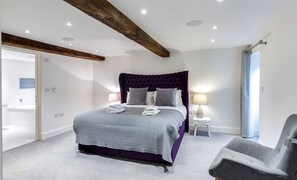 The bedroom with beams at The Shippon Cottage, Lake District