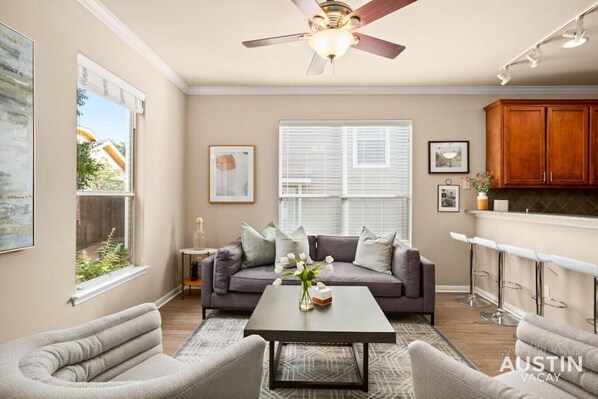 Living room with  lots of comfortable seating and smart TV