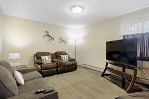 The first floor has a television and an online game room with lots of space for lounging.