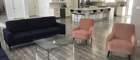 Seating area in the living room, kitchen and dry bar area. 