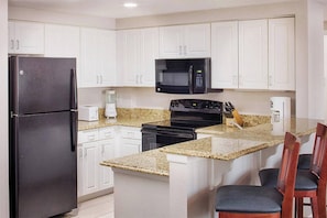 Breakfast counter with extra seating.