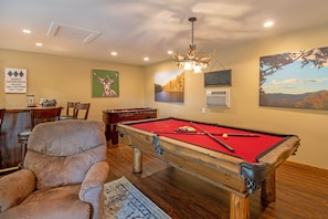 Recreation room with pool and foosball tables