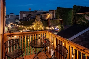 Private second level deck overlooking Champs beer garden and downtown