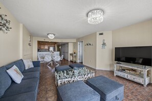 The ocean front living room is well-appointed with comfortable furnishings.