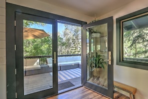French door from indoor dining to outdoor deck lounge space