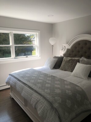 King bedroom with large walk in closet and blackout curtains 