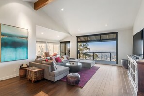 View upon entering the home with smart TV in the living room