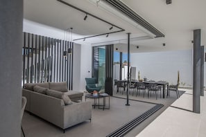 Living room leading out to outside dining area