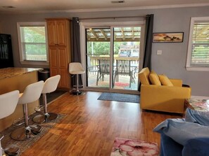 Lovely front porch with a dining table off the kitchen.Nice roof awning to enjoy