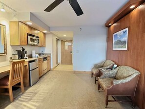 Kitchenette in the room with a sitting area and the murphy bed 
Listed with @BookTraverse
