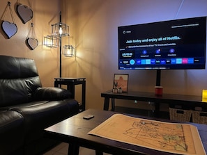 Relax and enjoy your favorite shows on our large smart TV, providing entertainment for everyone in the room.
