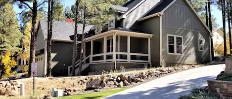 Front exterior with covered porch and 2 car garage