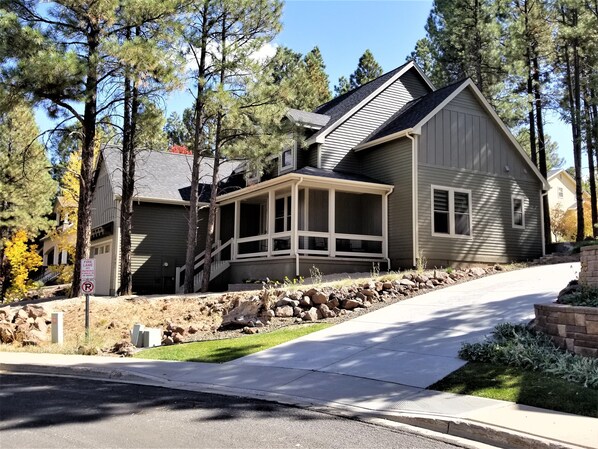 Front exterior with covered porch and 2 car garage