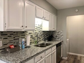 Kitchen with touchless faucet-automatic motion sensor. 