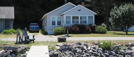 OVERALL:  The front of the cottage, highlighting the private dock and bonfire ring.