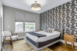 King bedroom on top floor with its own half bath and small balcony area.