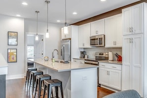 Fully stocked kitchen! Seating for 4 at the kitchen island.