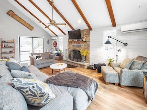 Family room with L-shaped sofa, oversized chair and reading chair.  Desk w chair