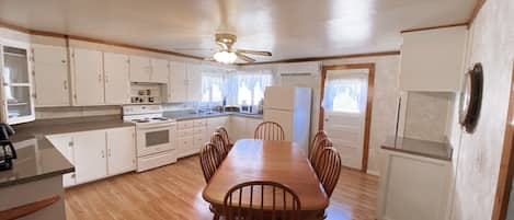 Kitchen - Eat in seating for 8. Dishwasher off to the right of table.