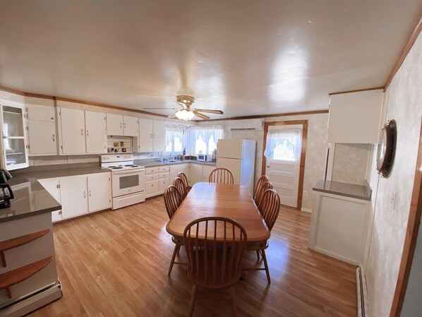 Kitchen - Eat in seating for 8. Dishwasher off to the right of table.