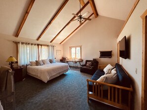 Upstairs bedroom with king bed, sofa sleeper and attached bathroom