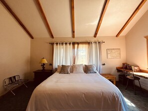 Upstairs bedroom with king bed, sofa sleeper and attached bathroom