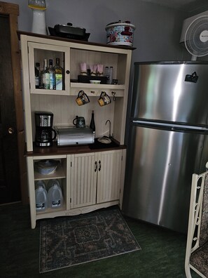 Coffee/Wine bar with water dispenser. Water also connects to icemaker in freezer