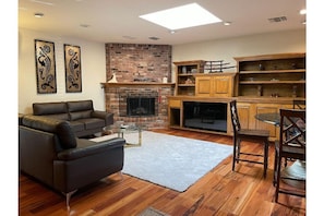 Great room living area with fireplace.