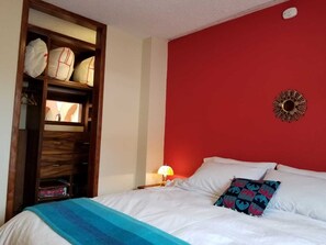 Ample wooden closet cabinet next to the bedroom.