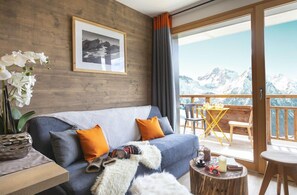 Relax on the comfortable sofa after a day outside. Some apartments may feature a balcony or terrace.