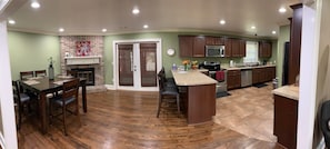 Open dining and kitchen area, door to game room