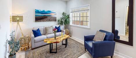Fabulous living room decorated in cool colors & with modern furniture and a new Roku TV!