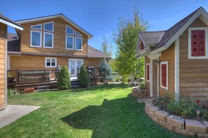 Hot Tub, grill, outdoor seating and a kids playhouse